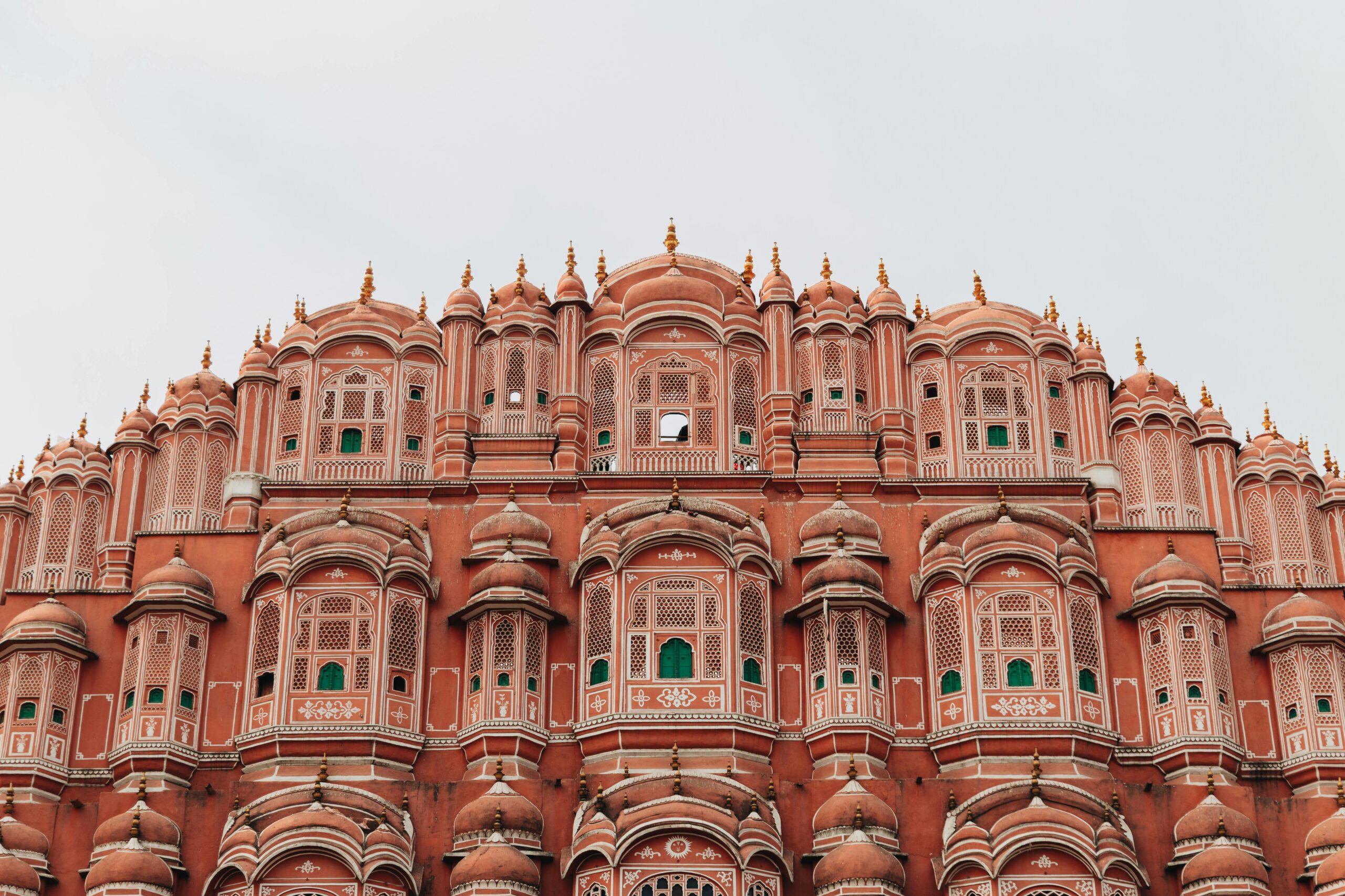 Hawa Mahal's iconic pink facade showcases stunning Rajasthani architecture in Jaipur, India.